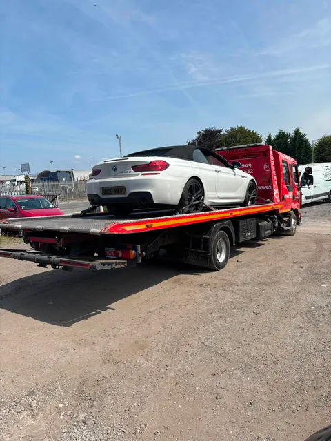 White BMW convertible on the recovery flatbed