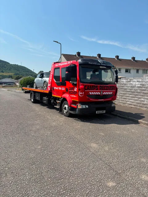 Camps Recovery flatbed truck with a Mini loaded, in Camps Recovery red livery