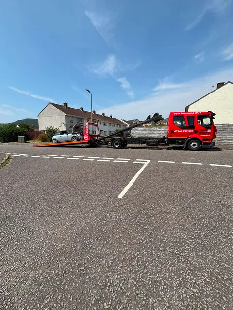 Small sports car loaded on the Camps Recovery truck